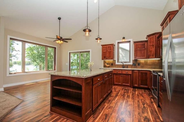 kitchen featuring open shelves, plenty of natural light, stainless steel appliances, and dark wood-style flooring