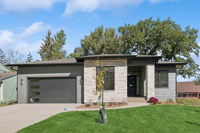 view of front facade with a garage, stone siding, concrete driveway, and a front yard