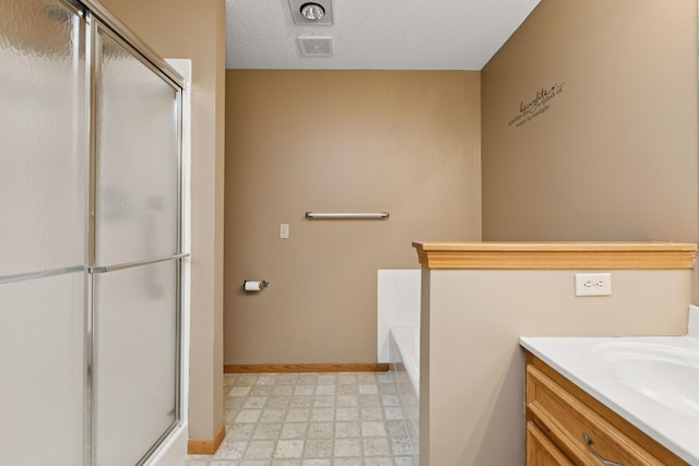 full bathroom featuring a stall shower, visible vents, a textured ceiling, and tile patterned floors