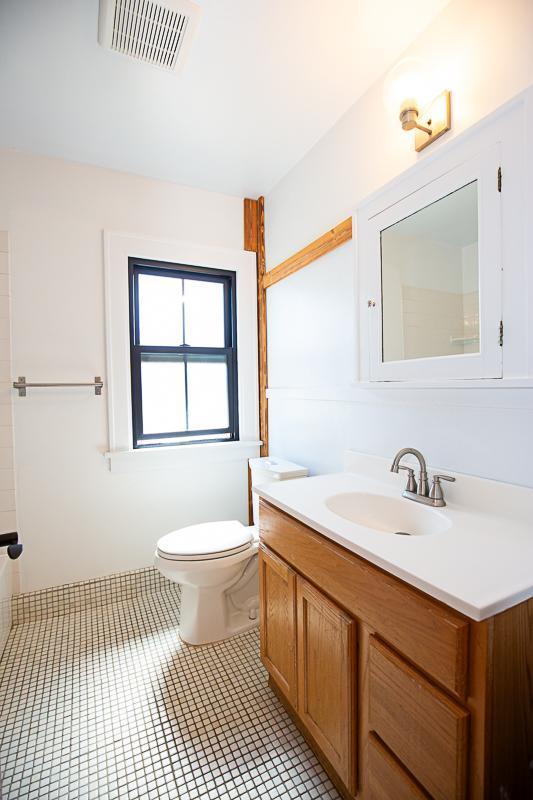 bathroom featuring toilet, tile patterned flooring, visible vents, and vanity