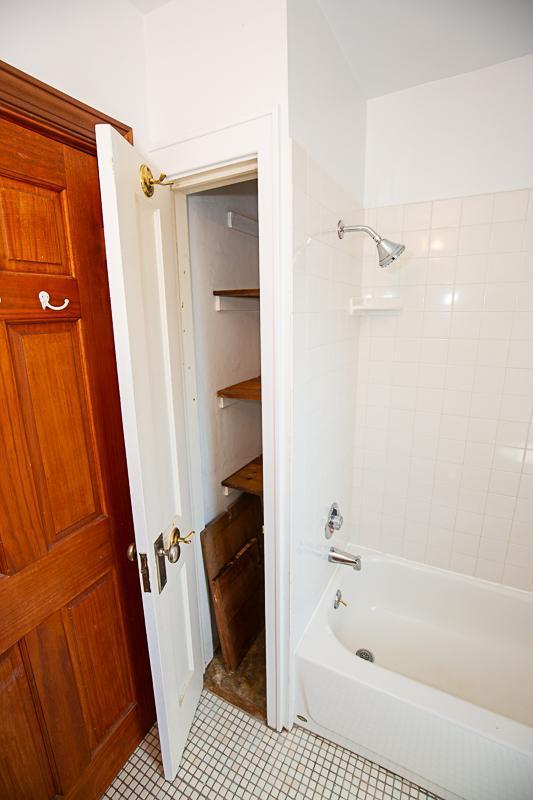 full bath with shower / tub combination and tile patterned floors