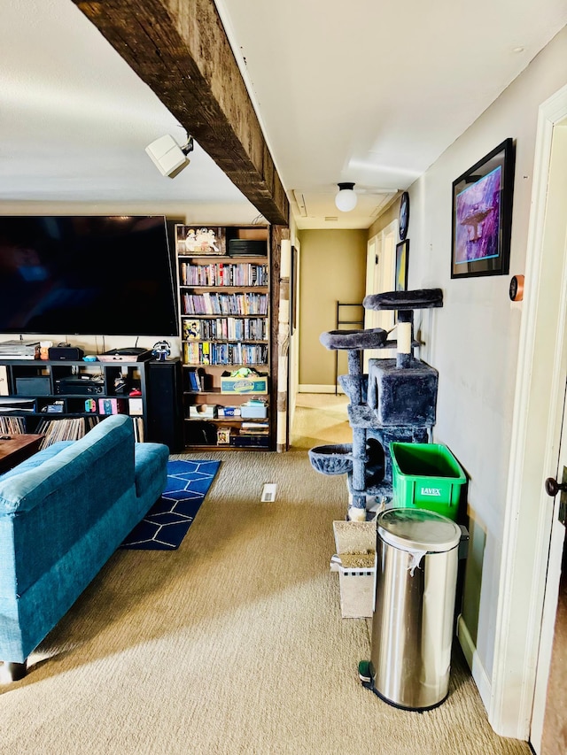 carpeted living room featuring baseboards