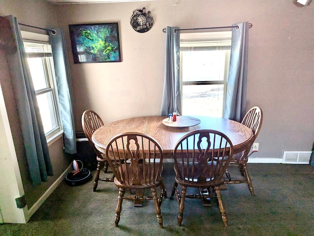 dining room with baseboards, visible vents, and carpet flooring