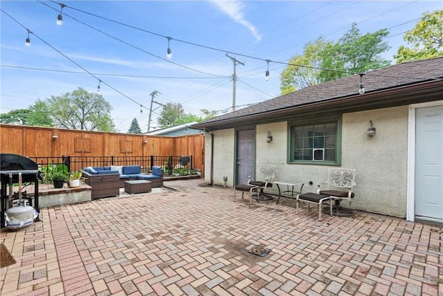 view of patio / terrace featuring fence and outdoor lounge area