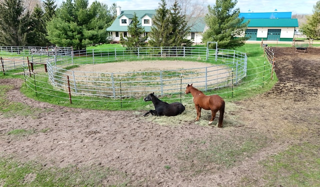 view of home's community with a rural view and an enclosed area