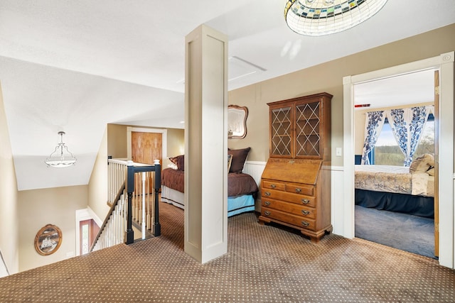 bedroom featuring wainscoting and carpet flooring