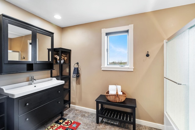 bathroom with baseboards and vanity