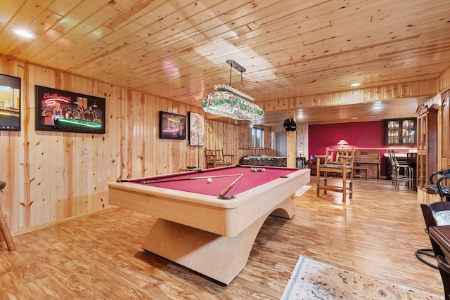 rec room featuring wooden ceiling, wood walls, pool table, and wood finished floors