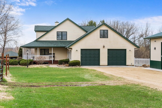 view of front of house with a chimney, fence, a shingled roof, a front yard, and a porch