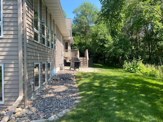 view of yard featuring a wooden deck