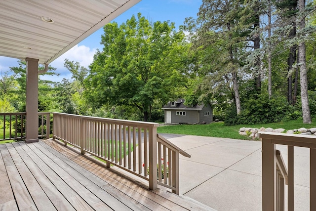 deck with an outbuilding and a yard