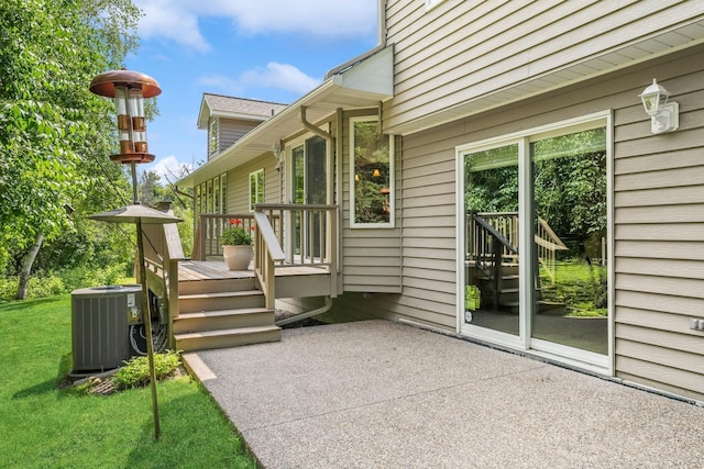 exterior space featuring a wooden deck and central air condition unit