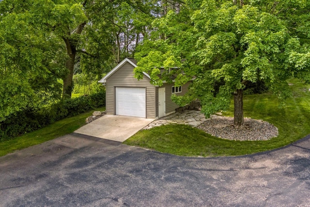 detached garage with aphalt driveway