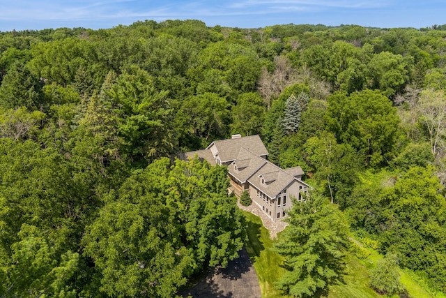 drone / aerial view featuring a view of trees
