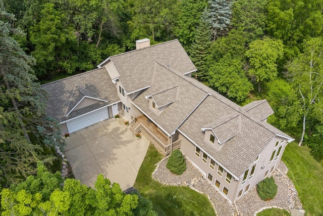 drone / aerial view with a view of trees