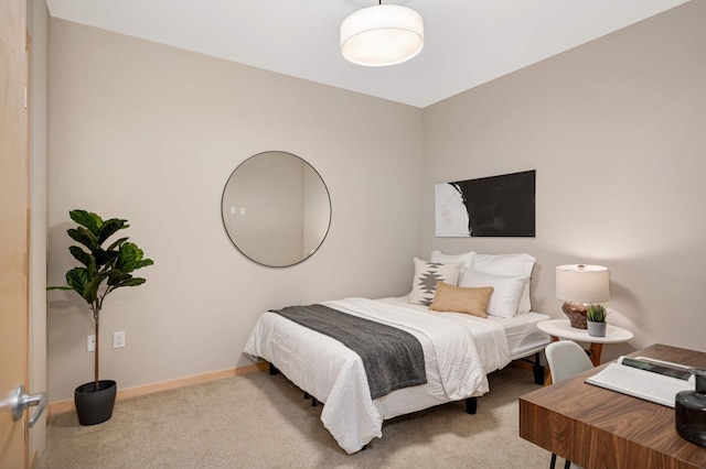 carpeted bedroom with baseboards