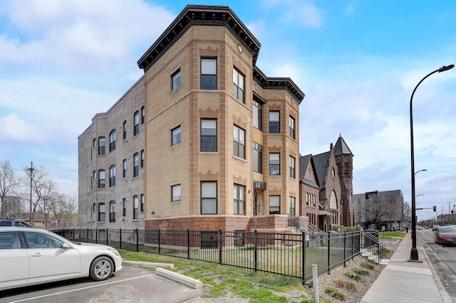 view of building exterior featuring fence