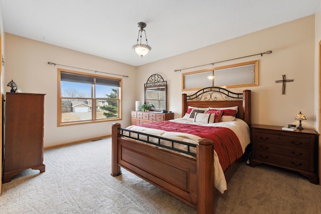 bedroom featuring light carpet, visible vents, and baseboards