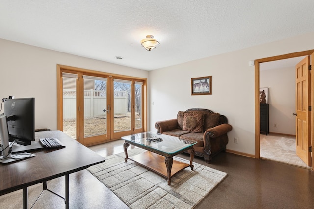 living area featuring a textured ceiling, french doors, and baseboards