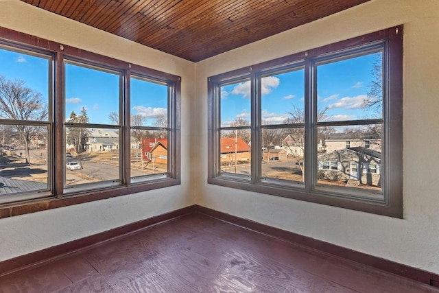 unfurnished sunroom featuring wooden ceiling