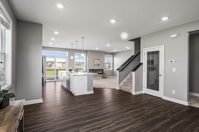 3485 109th Ln NE, Blaine, MN 55449 - kitchen with open floor plan, dark wood-style floors, light countertops, baseboards, and recessed lighting