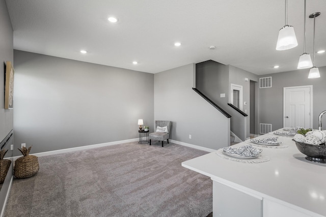3485 109th Ln NE, Blaine, MN 55449 - kitchen featuring carpet flooring, recessed lighting, baseboards, pendant lighting, and light countertops