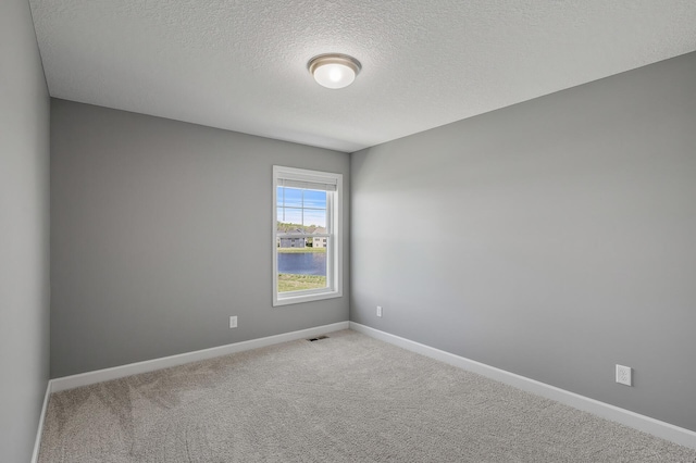 3485 109th Ln NE, Blaine, MN 55449 - carpeted spare room featuring a textured ceiling and baseboards