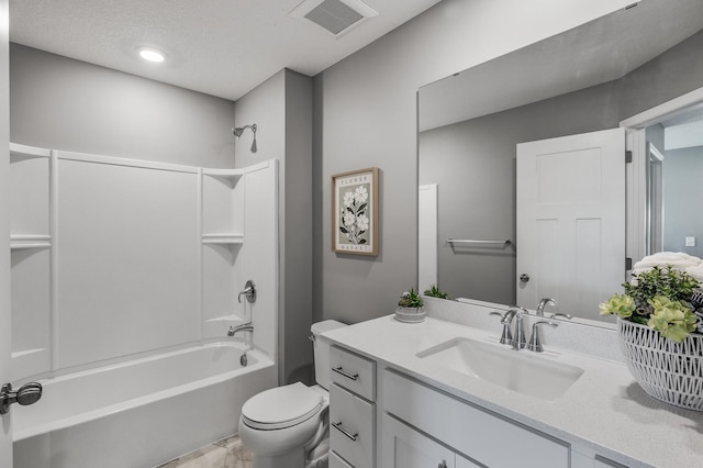 3485 109th Ln NE, Blaine, MN 55449 - full bathroom with washtub / shower combination, toilet, vanity, a textured ceiling, and marble look tiles