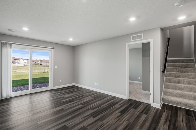 3485 109th Ln NE, Blaine, MN 55449 - unfurnished living room with dark wood finished floors, recessed lighting, stairway, baseboards, and a textured ceiling