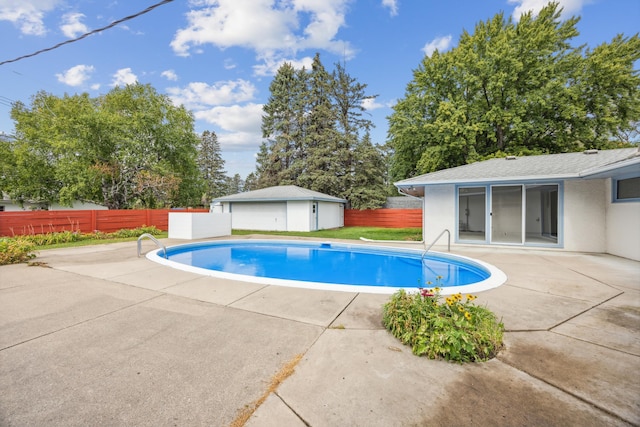 view of swimming pool featuring a fenced in pool, a patio, and fence