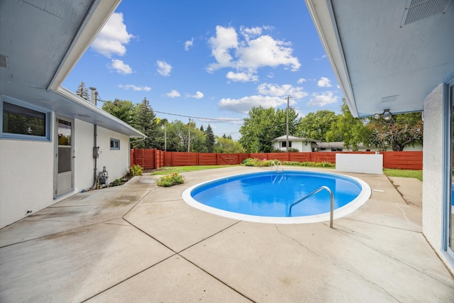 view of pool featuring a patio, a fenced backyard, and a fenced in pool