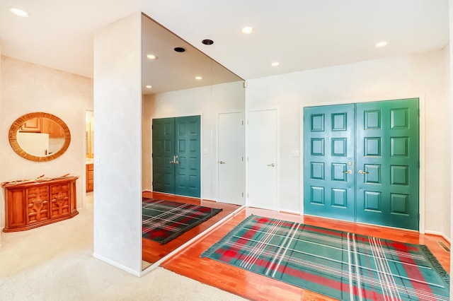 entryway featuring baseboards and recessed lighting