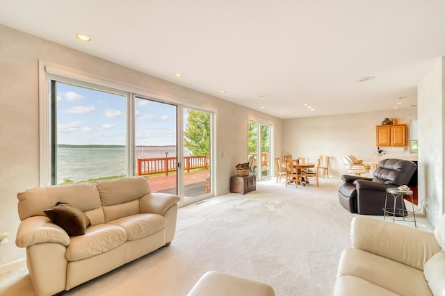 living room featuring light carpet and recessed lighting