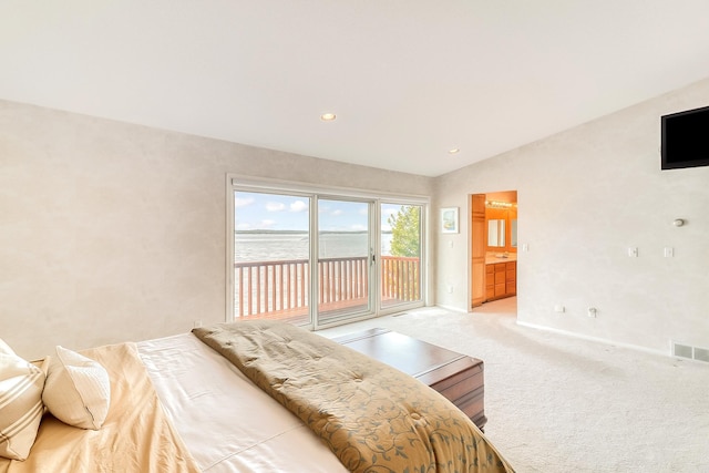 bedroom with access to exterior, lofted ceiling, light colored carpet, visible vents, and baseboards