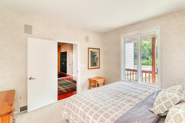 carpeted bedroom with visible vents