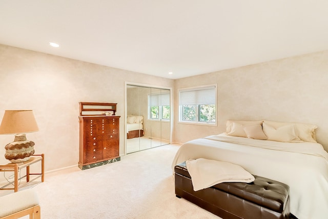 bedroom featuring a closet, carpet flooring, and recessed lighting