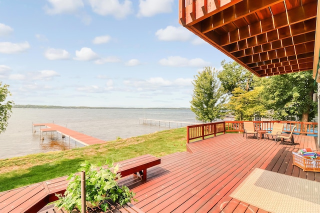 deck with a water view and a boat dock