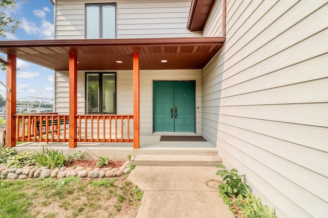 property entrance with covered porch