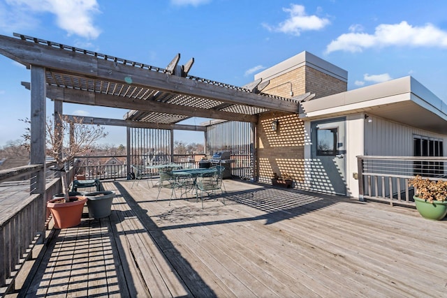 wooden deck featuring outdoor dining space and a pergola