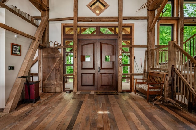 entrance foyer with dark wood-type flooring and stairway