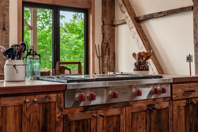 interior space featuring brown cabinetry and stainless steel gas stovetop