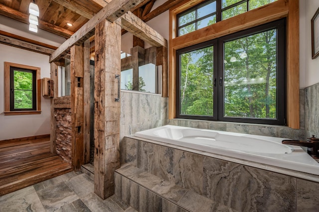 full bathroom featuring walk in shower and a garden tub