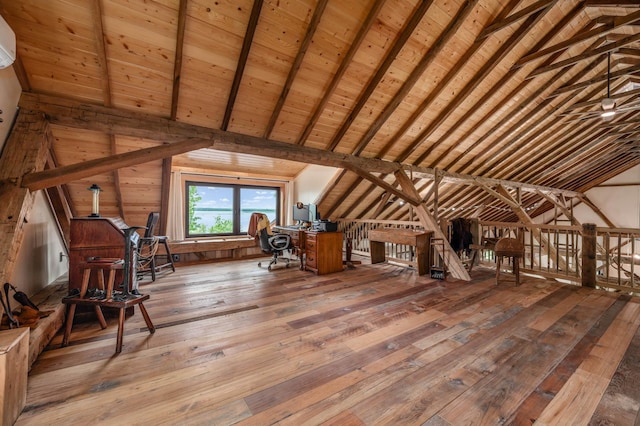 unfinished attic featuring an upstairs landing