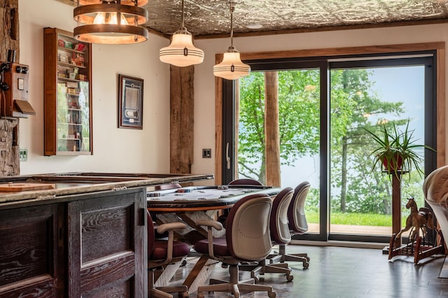 dining area with wood finished floors