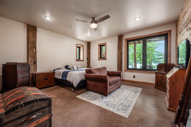 bedroom with finished concrete floors, recessed lighting, baseboards, and a ceiling fan