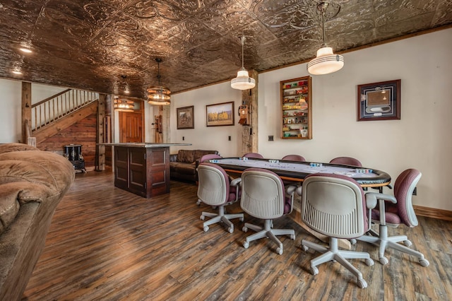 dining room with dark wood-type flooring, stairway, an ornate ceiling, and baseboards