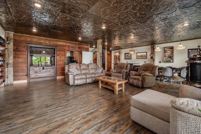 living area featuring an ornate ceiling and hardwood / wood-style flooring