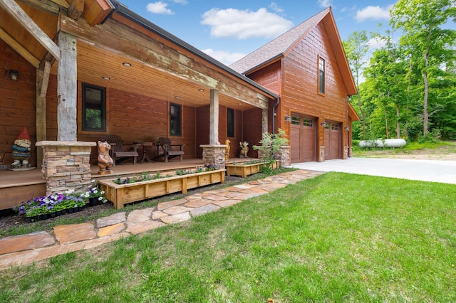 view of home's exterior with a garage, driveway, a porch, and a yard