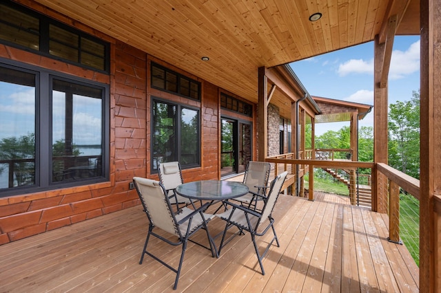 wooden deck featuring outdoor dining area