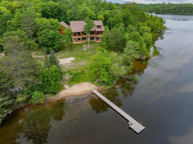 aerial view with a water view and a view of trees